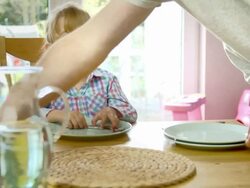 Young Father is Setting the Table for his Children Stock Footage