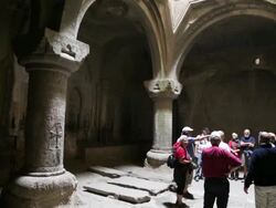 Geghard monastery, tourists in a church Stock Footage