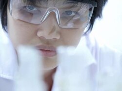 Scientist checking chemical containers Stock Footage
