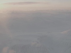 WS AERIAL View of Sun bright snowy landscape / Svalbard, Norway  Stock Footage