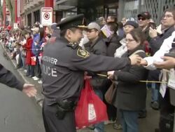 MS Shot of Vancouver Chief of Police greeting crowd in Chinese new years parade AUDIO / Vancouver, British Columbia, Canada Stock Footage