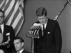 B/W 1961 President John Kennedy making speech + looking down / Mexican president sitting next to him Stock Footage