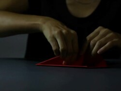 Woman making a paper airplane  Stock Footage