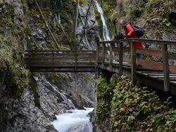 MS Woman walking along wild river through gorge Wimbach-Klamm / Berchtesgaden, Bavaria, Germany Stock Footage