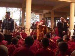  MS PAN Monks sitting in line AUDIO / Dharamsala, Himachal Pradesh, India Stock Footage