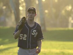 A young man playing catch with a baseball. - Slow Motion Stock Footage