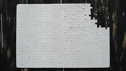 male hand adds white puzzle Stock Footage