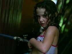 MS Little girl washing sand off her body and bathing suit under outside tap / Montezuma, Puntarenas, Costa Rica Stock Footage