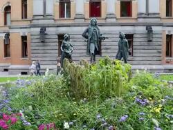 Oslo, statue of Ludvig Holberg Baron of Holberg (1684-1754), on both sides of him there are two figures Pernille and Henrik, outside Oslo's national theater Stock Footage