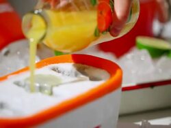 ECU R/F PAN Orange juice pouring into icecream tray for making icecream / Seoul, South Korea Stock Footage