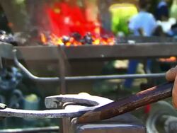 Blacksmith Forges a Horseshoe Stock Footage