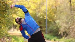 Young man stretching his arms after workout Stock Footage