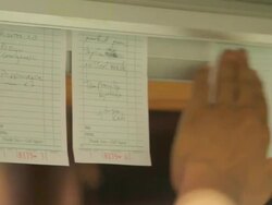 Male chef organising food orders in commercial kitchen Stock Footage