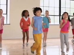 WS PAN Elementary School children running in gym / Richmond, Virginia, United States     Stock Footage