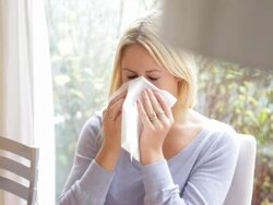 Young female sneezing and having a cold Stock Footage