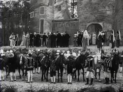 People in folkloric costume perform a Dutch folk-dance on stage Stock Footage
