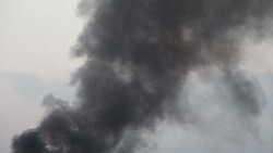 CLEAN : Black smoke fills the air after Israeli strike on Gaza port News Clip