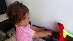 Baby scratching the wall in the bedroom Stock Footage