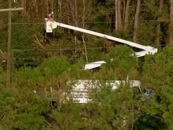 Sept. 11, 2005 aerial electricity repair team working with cherry picker after hurricane / Louisiana Stock Footage