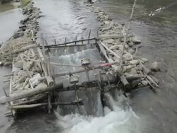 WS small hydroelectric generators in river / Xam Neua, Laos Stock Footage