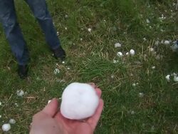 Person holding huge hailstone in hand, tennis ball sized hail stone, giant hail, MS, South Plains, Texas, USA Stock Footage