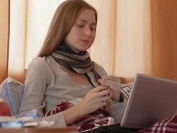 Sick Woman in Bed Blowing Nose Stock Footage