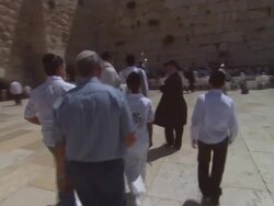 WS DS POV Group in tallits and yarmulkes carrying Torah at Wailing Wall / Jerusalem, Israel Stock Footage