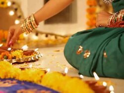 Woman arranging oil lamp in diwali festival Stock Footage