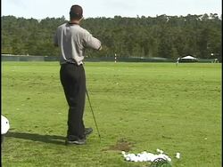 Tiger Woods practices golf swings Stock Footage