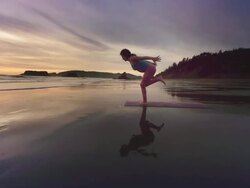 WS POV ZI ZO Woman doing yoga on beach/ Bandon, OR, United States  Stock Footage