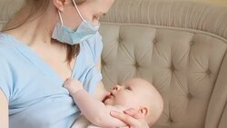Sick mother breastfeeding her baby Stock Footage