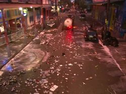 Wide Shot - Workers sweeping and spraying street clean / New Orleans Louisiana Stock Footage