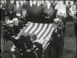 A large crowd gathers at Arlington National Cemetery before the burial of U.S. President John F. Kennedy. News Clip