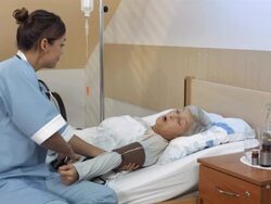 HD DOLLY: Nurse Checking Blood Pressure Stock Footage