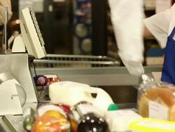 Barcode scanning groceries at shopping supermarket Stock Footage