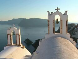 WS View of church bell and houses at village Oia with Ocean / Santorini, Cyclades, Greece Stock Footage
