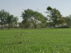 Golfer hitting wedge shot in slow motion Stock Footage