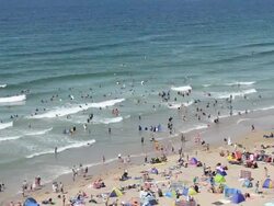 Tourists enjoy Watergate bay, Newquay, Cornwall Stock Footage
