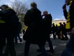 Low angle long shot of fans walking towards Stock Footage