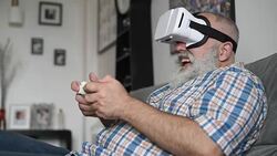 adult senior man and a virtual reality headset. graybearded man using vr glasses Stock Footage