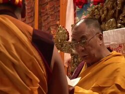  MS Dalai Lama sitting at front of temple as some monks stand at attention waiting for cue AUDIO / Dharamsala, Himachal Pradesh, India Stock Footage