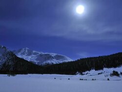 full moon travelling across winter landscape Stock Footage