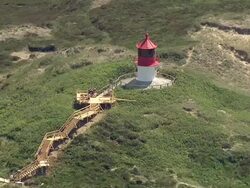 MS AERIAL View of lighthouse/ FoehrAmrum, Schleswig-Holstein, Germany Stock Footage