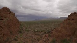 Fly over ridge to reveal lightening storm at Big Bend National Park at Chilicotal Stock Footage
