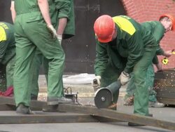 A Man Using a Cutoff Saw to Cut the Metal Stock Footage