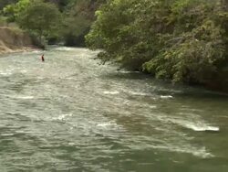 "Wide of man fishing with net in middle of Utcubamba River [Rio Utcubamba], Peru [PerÃƒÂº]" Stock Footage