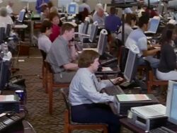 September 2005 Medium shot pan volunteers working on computers at Hurricane Katrina relief command center / Alpharetta, Georgia Stock Footage