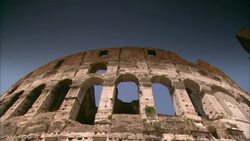 Blue sky shows through arched windows of the Roman Colosseum. Stock Footage