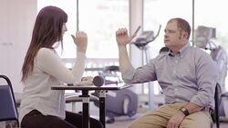 Female occcupational therapist working with an adult patient Stock Footage