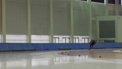 MS SLO MO Male long track speed skater practicing on track in arena Stock Footage
